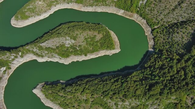 Aerial top view of curved meanders in canyon of Uvac river, Serbia, 4k