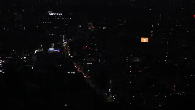 Cinematic night street view of Seoul's modern architecture and lights