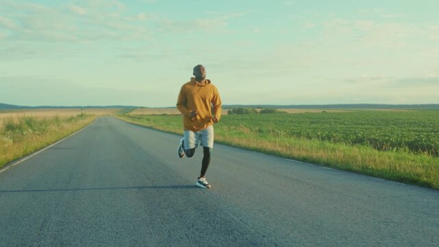 Morning run through countryside, Athletic individual maintaining steady pace during early morning rural journey