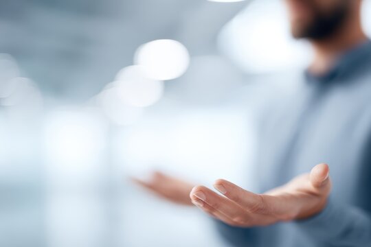 Ambitious startup founder presenting an idea, blurred office background, motion blur on hands