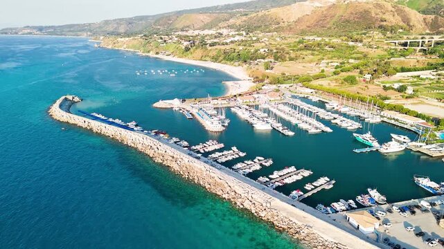 Dramatic aerial view of Tropea Calabria coastline and historic city from drone perspective