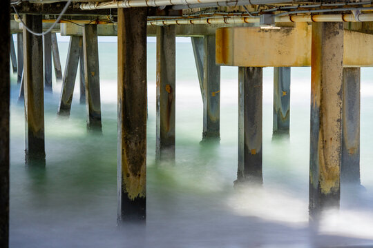 Long exposure stock image under a fishing pier Dania Beach Florida