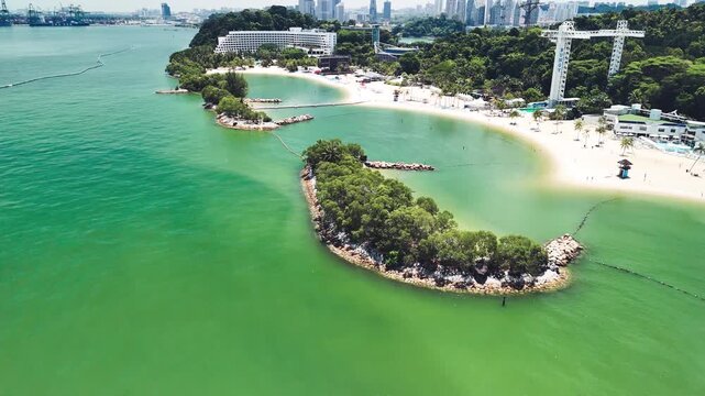 Sentosa Island beach aerial shot showing coastline, sandy shore, and relaxing vacation atmosphere