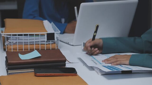 Businessman and Certified Public Accountant (CPA) auditor providing accounting and auditing services in the same company and stock market chart data and anti bribery of accounting
