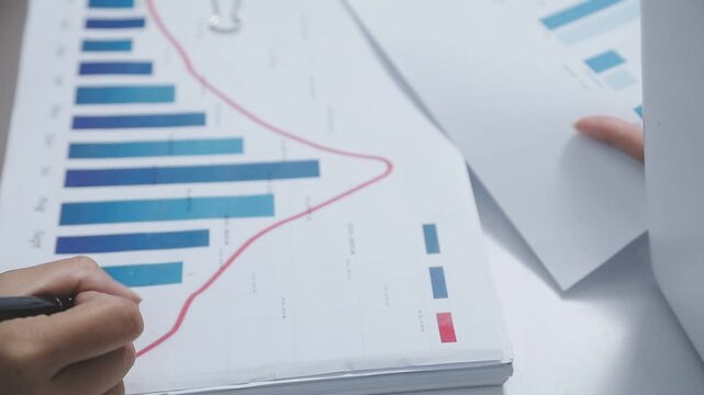 Businessman and Certified Public Accountant (CPA) auditor providing accounting and auditing services in the same company and stock market chart data and anti bribery of accounting