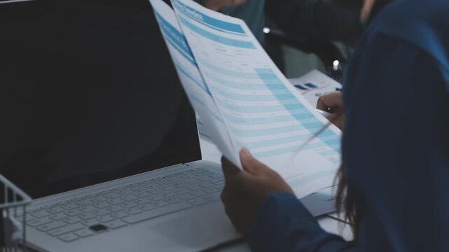 Businessman and Certified Public Accountant (CPA) auditor providing accounting and auditing services in the same company and stock market chart data and anti bribery of accounting