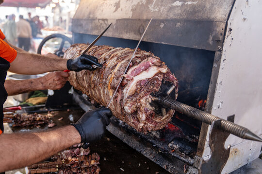 Traditional Erzurum Cag Kebab Cooking on Horizontal Rotisserie Grill