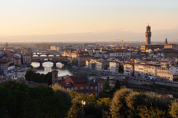 Fototapeta premium Panoramic View of Florence Cityscape with Arno River and Ponte Vecchio at Golden Hour