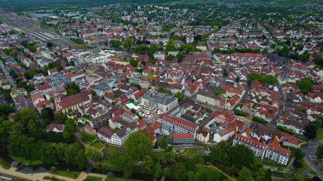 Aerial view around the city Offenburg in Germany. On cloudy day in spring beside the river Enz