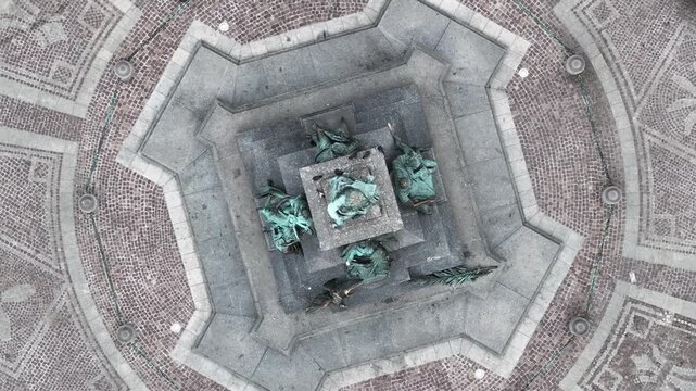 Top Down Drone 360 Rotation over Adam Mickiewicz Monument with Pigeons, Krakow Main Market Square, Poland, 4K 60fps