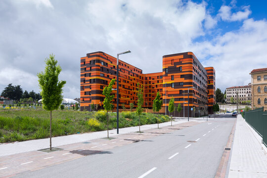 Modern sustainable coliving building with orange facade
