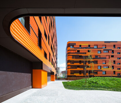 Contemporary orange facade on modern housing complex