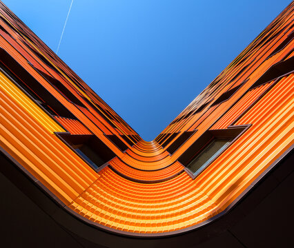 Modern architectural marvel with vibrant orange facade