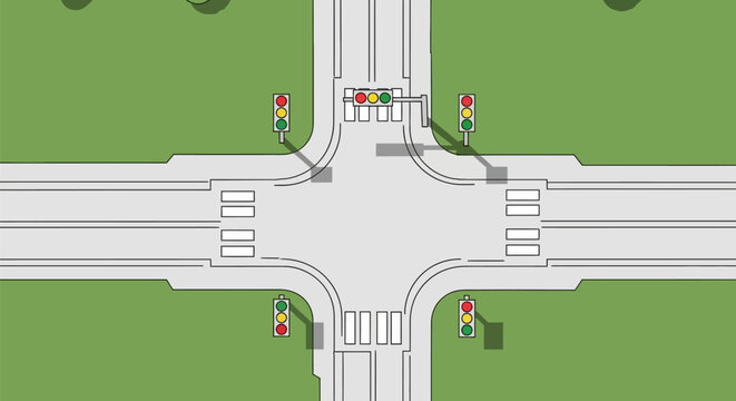 Aerial view of a four way road intersection.