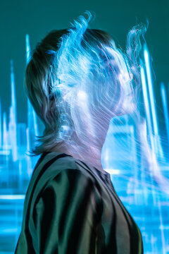 Young woman in futuristic metaverse with fiber optics