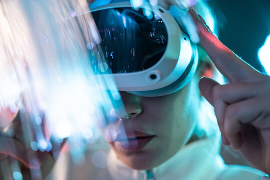 Young woman exploring futuristic metaverse realm
