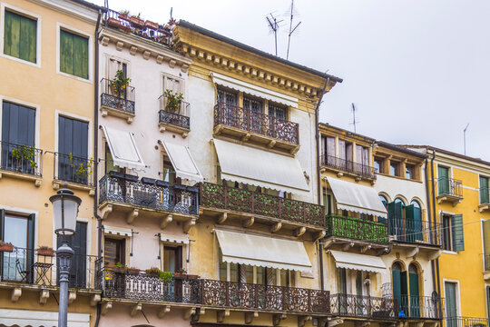 Historic balcony facades with awnings in Padova, Italy