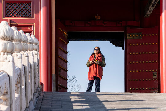 Traveler enjoys audio tour in Beijing, China