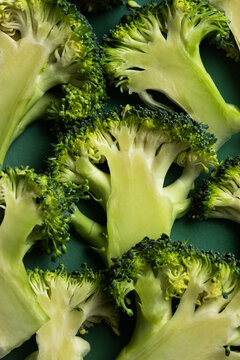 Close-up of fresh broccoli florets on dark plate