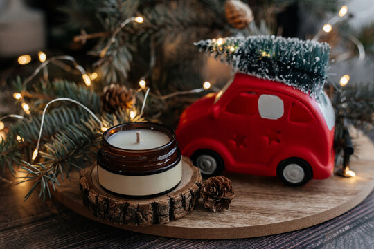Soy wax candle with festive decorations for holidays