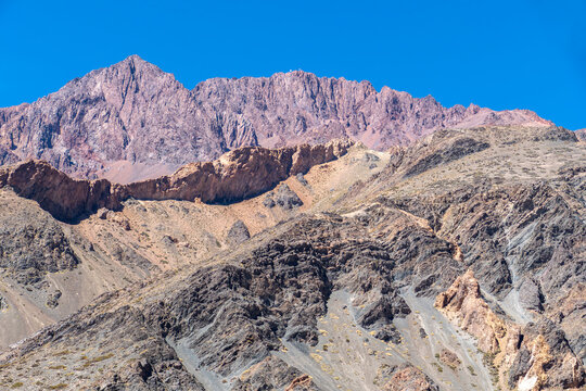 landscape at altiplano in Argentina with  mountains and road in the valley at Ruta Sanmartiniana in departimento Las Heras at Road 7