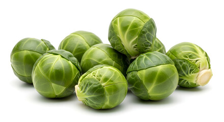 Fototapeta premium Fresh raw green brussels sprouts piled together on a clean white background, highlighting healthy eating and organic produce.