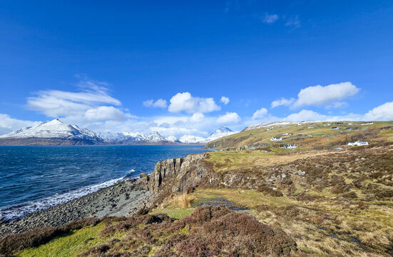 View from Elgol over the sea to The Cuillins with fresh snow on the mountains from Storm Dave. Isle of Skye, Scotland