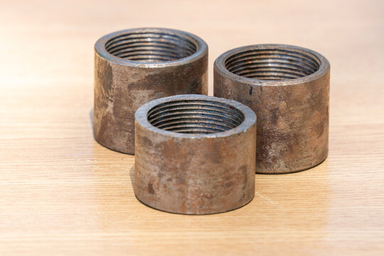 Metal threaded cylinders with rust and steel contrast