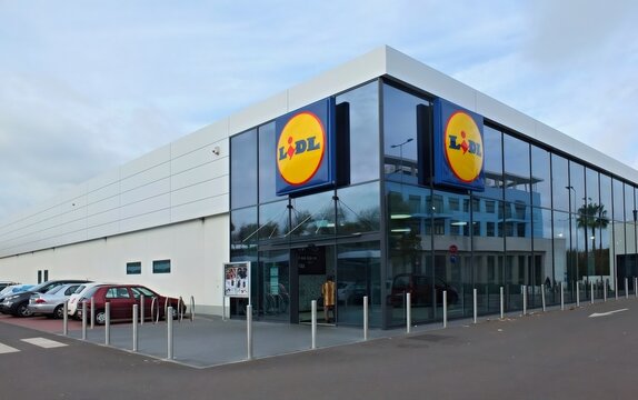Lidl supermarket building with logo and parking lot