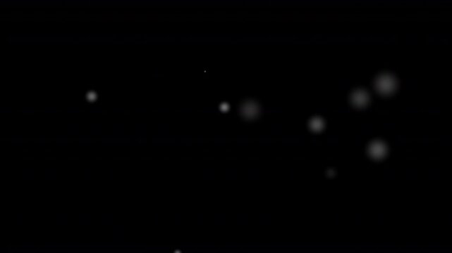 light spots of dust or floating white orb balls of magical pollen haze seeds floating and swirling in the air animated on a plain black background 4k special effect animation