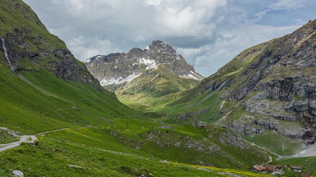 A time-lapse of clouds drifting above a mountain landscape near Engelberg, Breitstock mountain peak, Switzerland.