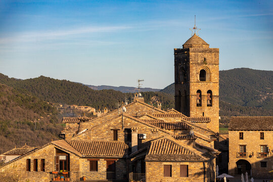View of the medieval village of Ainsa, Huesca, Aragon, Spain, with golden sunset light