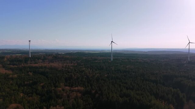 Aerial countryside landscape with wind turbines and wind farm near Starnberg, Bavaria. Clean power generation with industrial windmills and eco friendly technology.