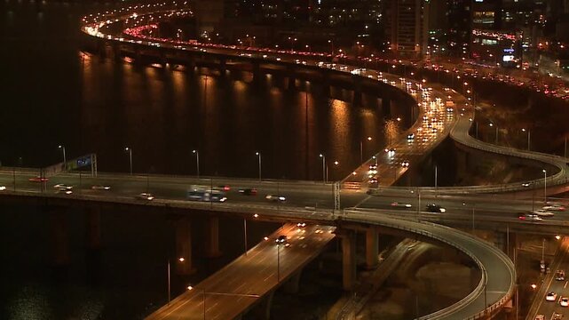 Cinematic night street view of Seoul's modern architecture and lights