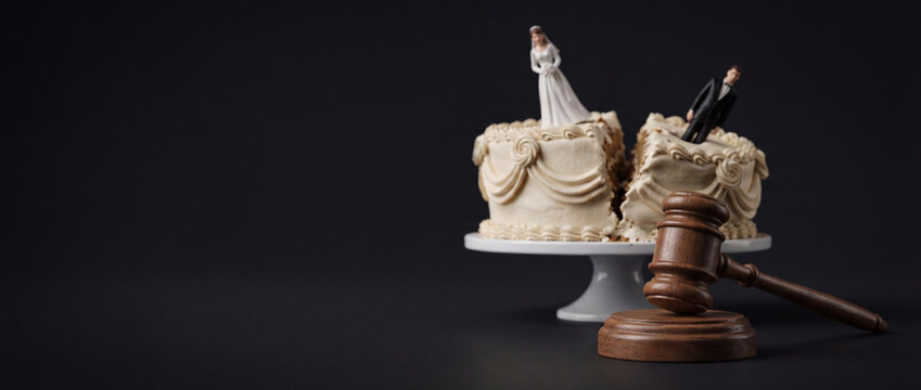 Falling apart wedding cake with judge gavel, collapsed marriage, divorce case in court concept, family meltdown, separation