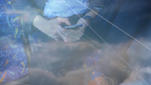 Seated man tapping phone on train, causing cloud network overlays and charts showing tech metrics