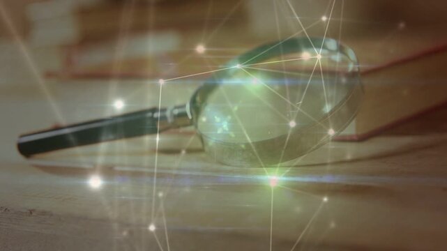 Magnifying glass resting on wood desk, animated network appearing creating shifting glares for tech
