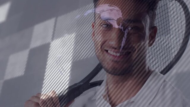 Vertical video: Man holding racket, projector sweeping map into globe on face smiling for sports