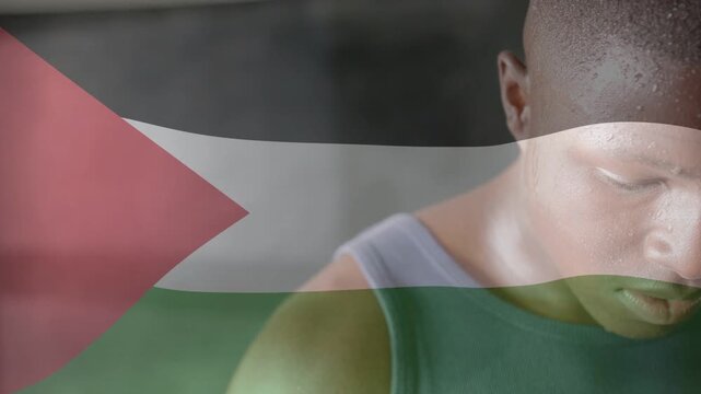 Male trainee pausing breath, lifting head with sweat while translucent flag rippling, fitness focus