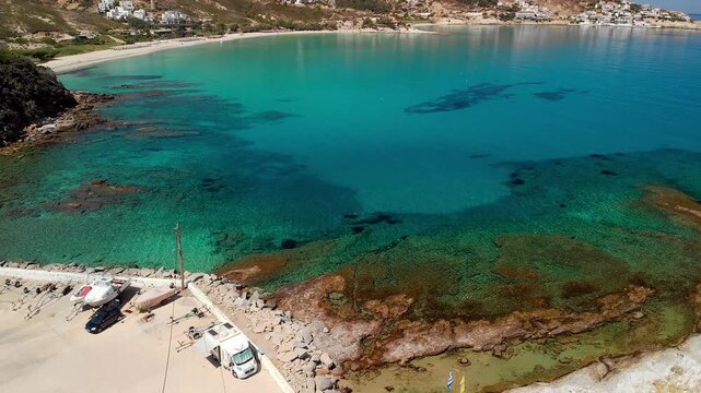 The beach and port of Gialiskari and the chapel Analipsi, Ascention in Ikaria island, Greece