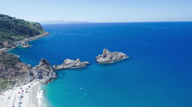 Ulivarella Beach and Ulivo Rock aerial view in slow motion, Calabria, Italy