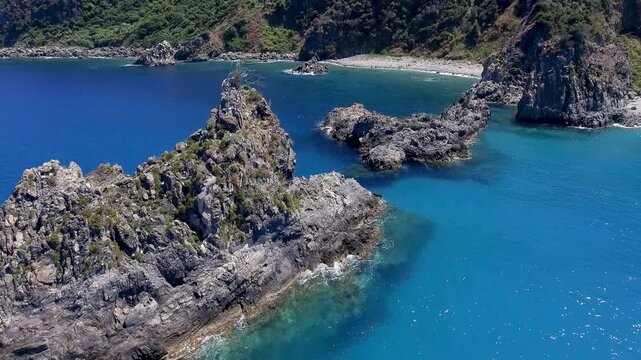 Aerial view of rock of the ulivarella, Tonnara di Palmi, Calabria, Italy. Slow motion