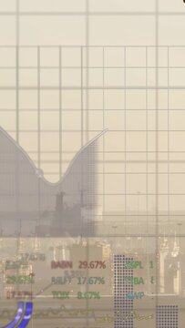 Vertical video: Hazy port showing ship, grid rising and charts rising over ship with shipping data