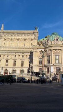 Tour guide leading group across opera plaza cinematic exterior