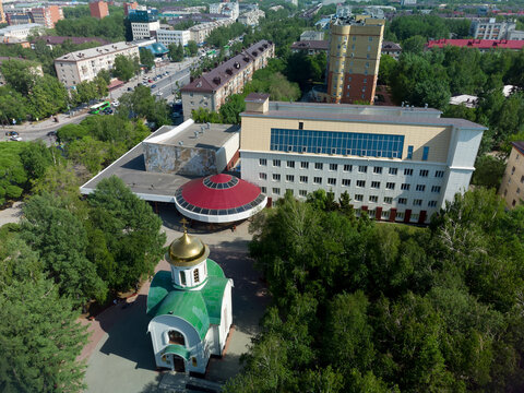 Aerial drone view of Tyumen State Institute of Culture, St. Dmitry Donskoy Church and Gubkin Square in Tyumen, Russia, May 25, 2021