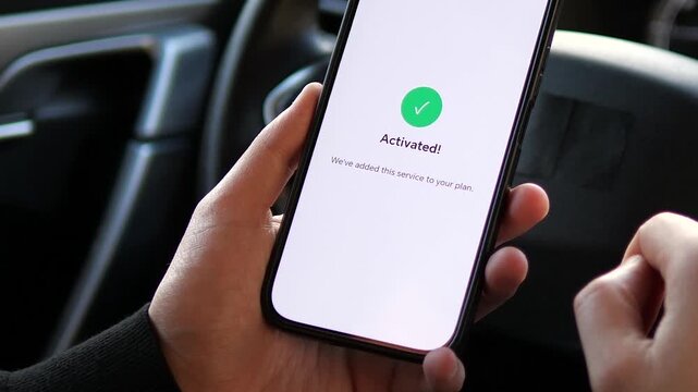 Close-up of a hand activating a monthly cloud storage subscription on a smartphone. Modern mobile app UI showing a successful transaction and service activation. Perfect for SaaS, fintech, and digital