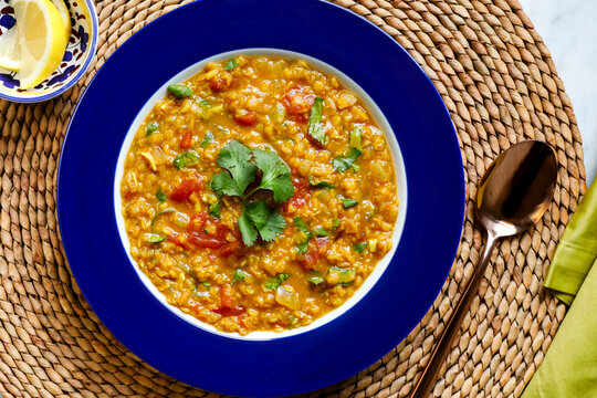 Vegetable barley stew in blue bowl