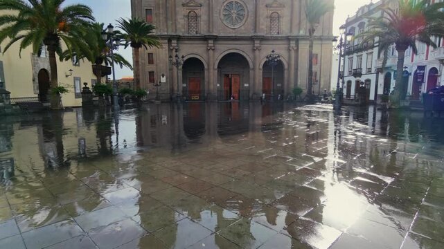 Magnificent facade of the Cathedral of Santa Ana in Las Palmas de Gran Canaria, silhouetted against the bright sun