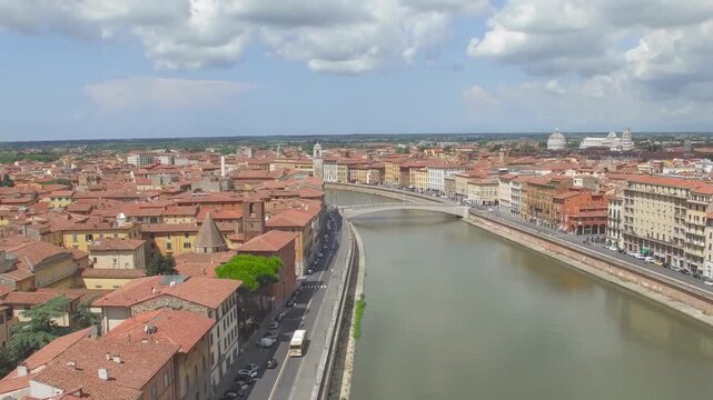 Drone panorama of Pisa Lungarni and historic buildings by river