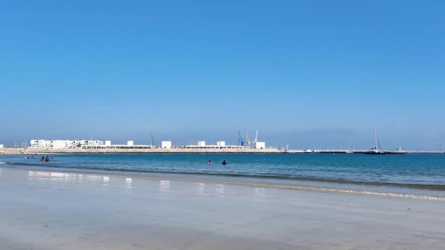Tangier Beach Morocco Pan from Port to Sea with Football Activity Ocean Waves and Summer Lifestyle Scene